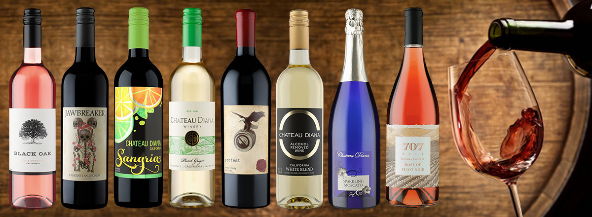 A spread of wines in front of a wooden background.